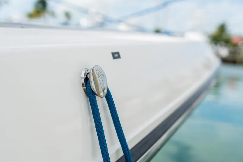 Slide: The Image of Close-up of 2023 Boston Whaler 360 Outrage boat with blue rope tied. - 14