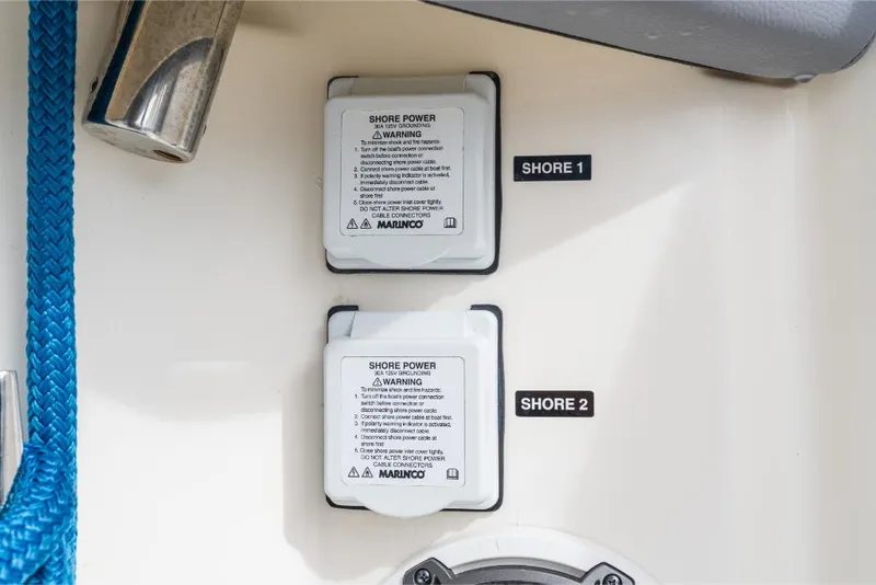 Slide: The Image of Shore power outlets on a 2023 Boston Whaler 360 Outrage boat. - 15