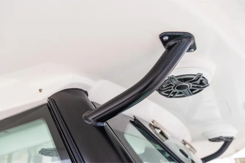 Slide: The Image of Close-up of 2023 Boston Whaler 360 Outrage boat's grab handle and speaker. - 17