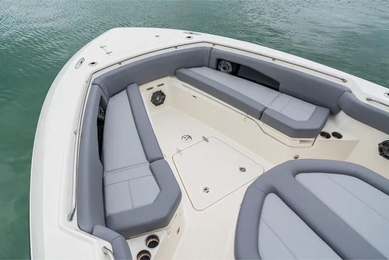 Slide: The Image of 2023 Boston Whaler 360 Outrage boat interior with gray cushioned seating. - 25