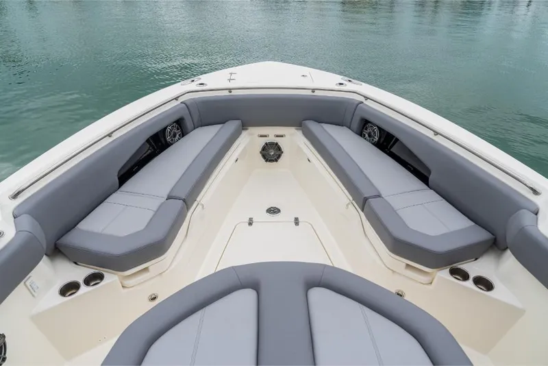 Slide: The Image of 2023 Boston Whaler 360 Outrage boat interior with cushioned seating. - 27