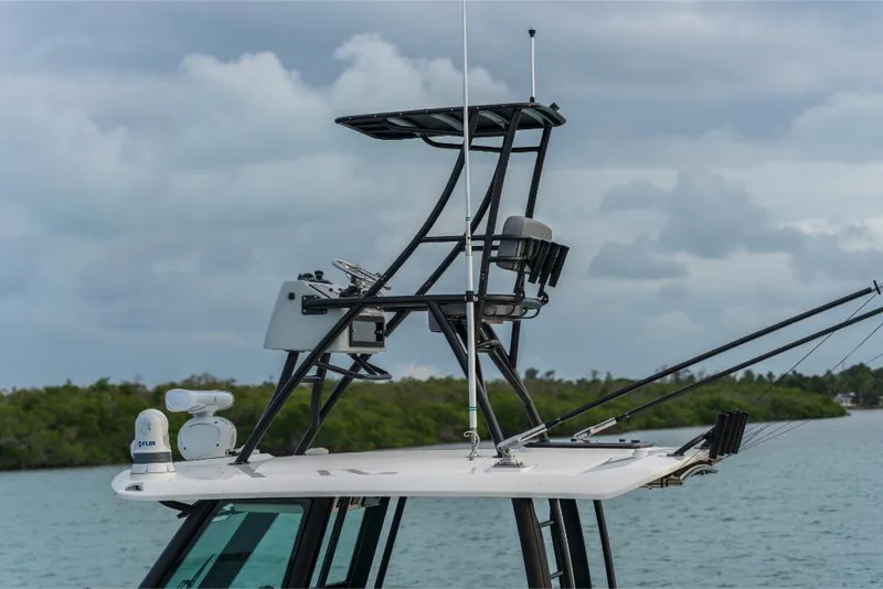 Slide: The Image of 2023 Boston Whaler 360 Outrage boat with advanced navigation equipment. - 36