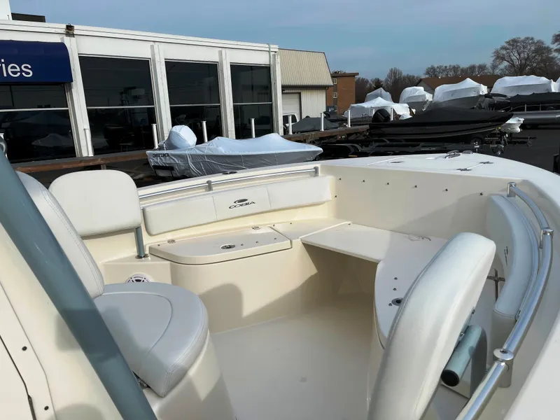 Slide: The Image of 2022 Cobia 220 CC boat interior with seating and storage compartments. - 17