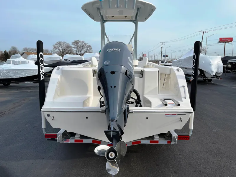 Slide: The Image of 2022 Cobia 220 CC boat with outboard motor, rear view. - 3