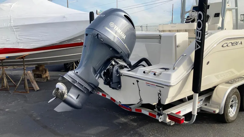 Slide: The Image of 2022 Cobia 220 CC boat with Yamaha outboard motor on trailer. - 4