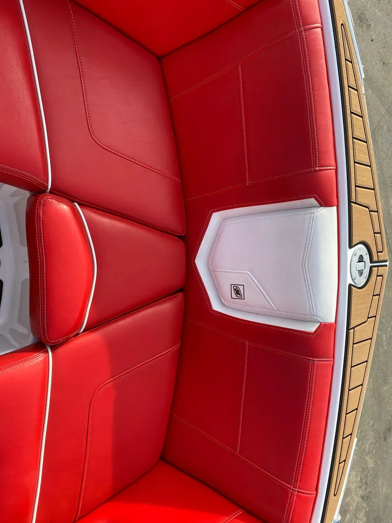 Slide: The Image of Red and white interior seating of 2018 Nautique G23 boat. - 30