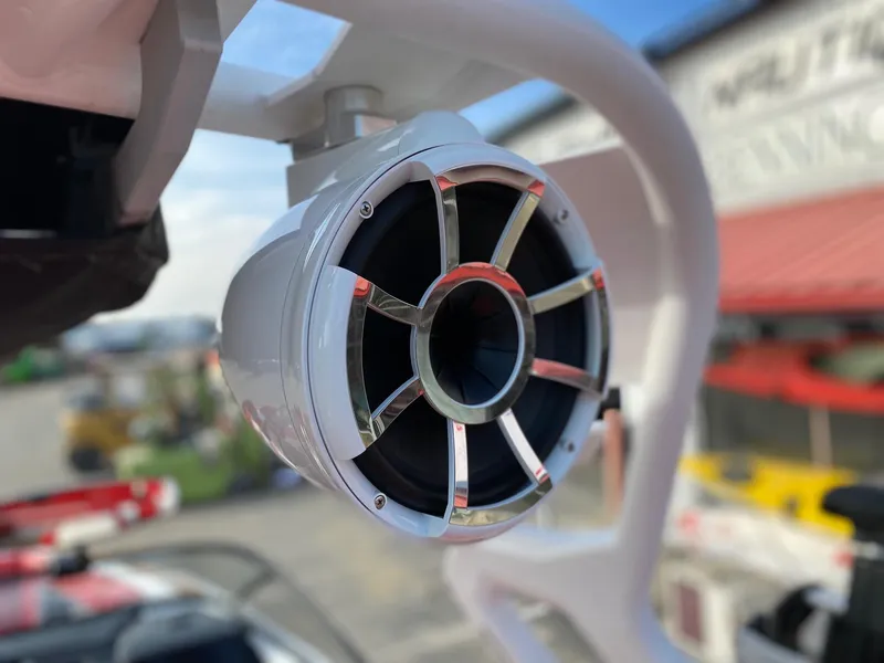Slide: The Image of Close-up of a 2018 Nautique G23 boat speaker with a sleek metallic grille. - 32