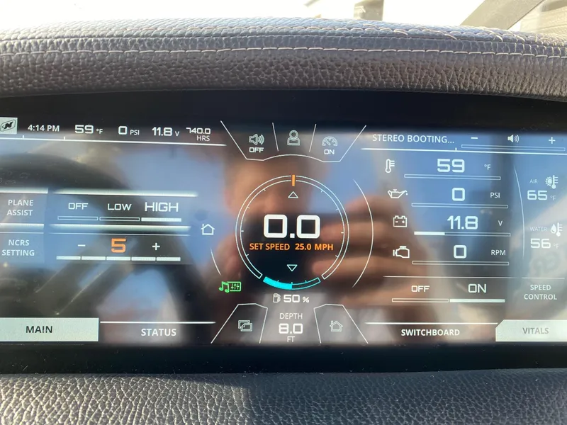 Slide: The Image of Dashboard of a 2018 Nautique G23 boat displaying speed, temperature, and system settings. - 37