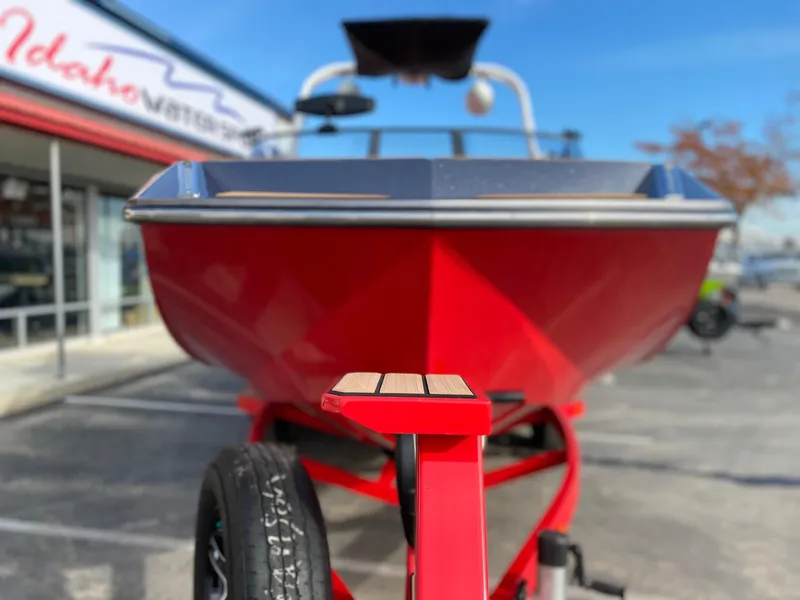 Slide: The Image of 2018 Nautique G23 boat in vibrant red on a trailer at Idaho Watersports. - 6
