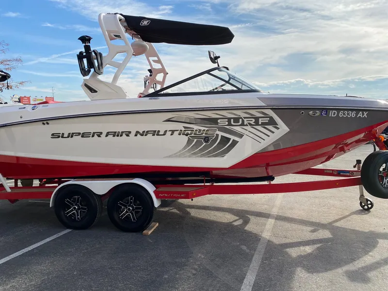 Slide: The Image of 2018 Nautique G23 Super Air Surf boat on trailer, parked outdoors. - 9