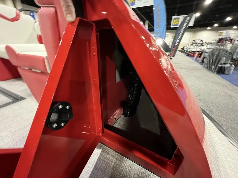 Slide: The Image of Red interior compartment of 2022 Montara SURF BOSS 23 boat at a showroom. - 13