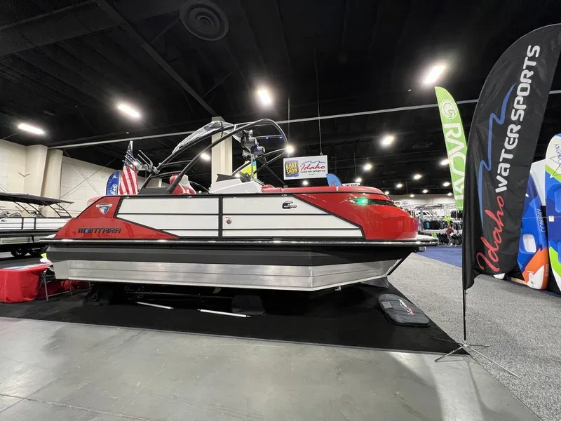 Slide: The Image of 2022 Montara SURF BOSS 23 boat displayed at Idaho Water Sports event. - 2