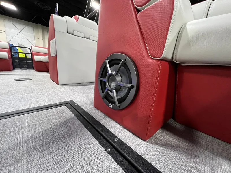 Slide: The Image of 2022 Montara SURF BOSS 23 interior with red and white seating and speaker system. - 20