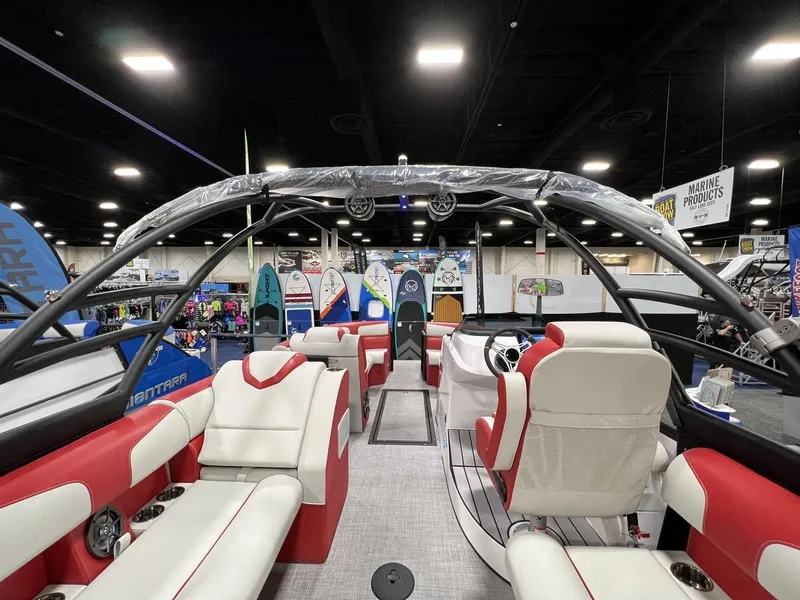 Slide: The Image of Interior of 2022 Montara SURF BOSS 23 boat with red and white seating. - 22