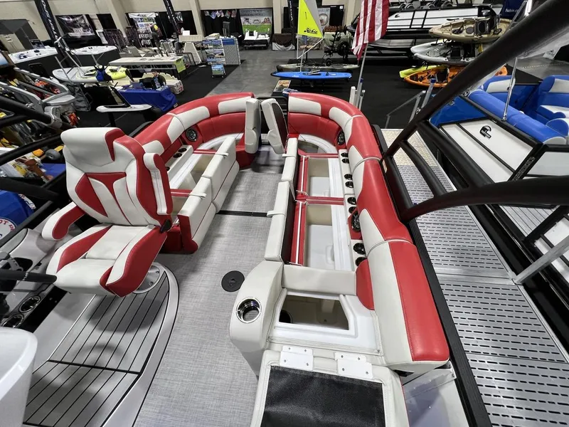 Slide: The Image of 2022 Montara SURF BOSS 23 boat interior with red and white seating at a boat show. - 24