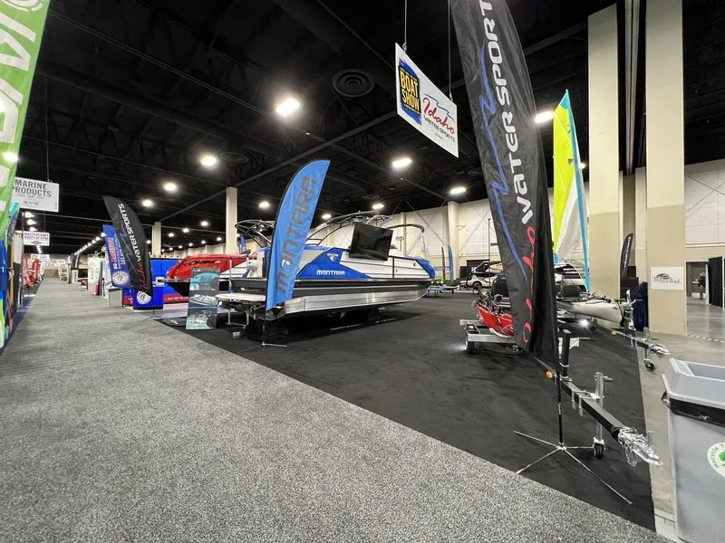 Slide: The Image of 2022 Montara SURF BOSS 23 displayed at a boat show with promotional banners. - 28
