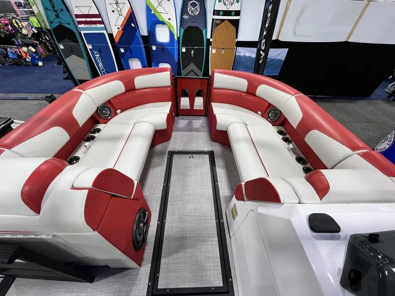 Slide: The Image of 2022 Montara SURF BOSS 23 boat interior with red and white seating, showcasing surfboards. - 9