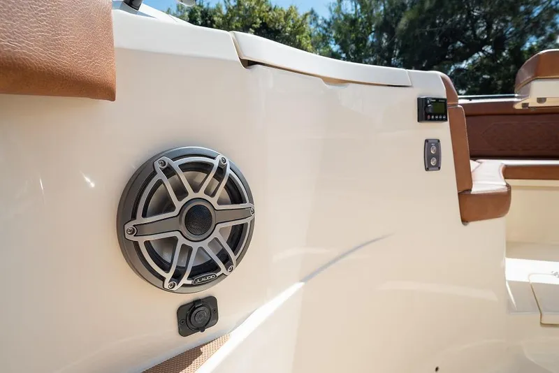 Slide: The Image of 2025 Scout 330 LXF boat interior with JL Audio speaker and control panel. - 18