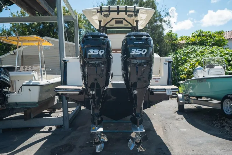 Slide: The Image of 2025 Scout 330 LXF boat with twin 350 Verado engines. - 2