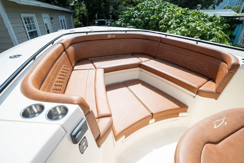 Slide: The Image of Luxurious seating area on the 2025 Scout 330 LXF boat with tan leather upholstery. - 31