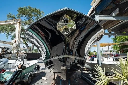 Slide: The Image of 2025 Scout 330 LXF boat in a marina, front view. - 42