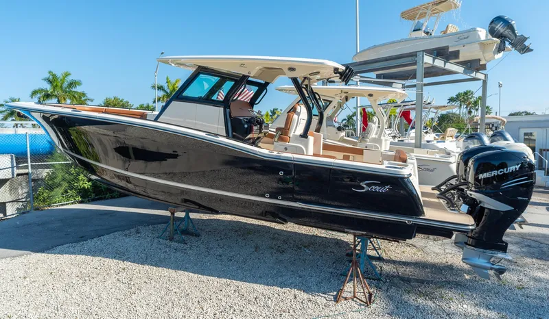 Slide: The Image of 2025 Scout 330 LXF boat with Mercury outboard engines on display. - 43