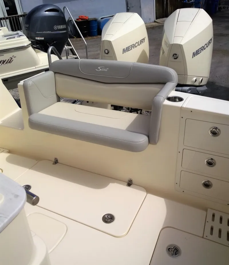 Slide: The Image of 2025 Scout 305 LXF boat with Mercury and Yamaha engines, featuring a comfortable seating area. - 14