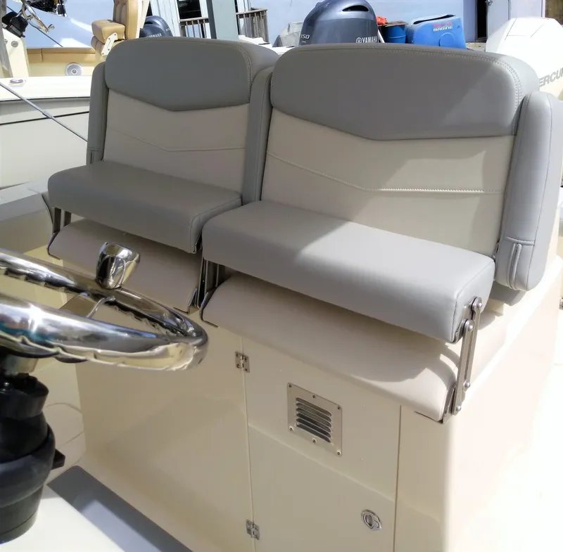 Slide: The Image of 2025 Scout 305 LXF boat helm seats and steering wheel. - 15