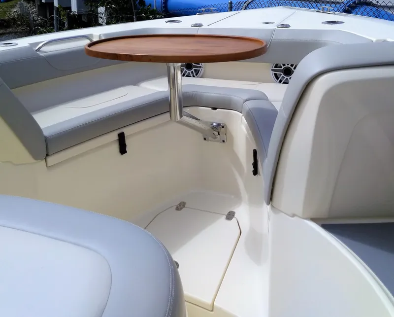 Slide: The Image of Interior seating and table of 2025 Scout 305 LXF boat. - 8