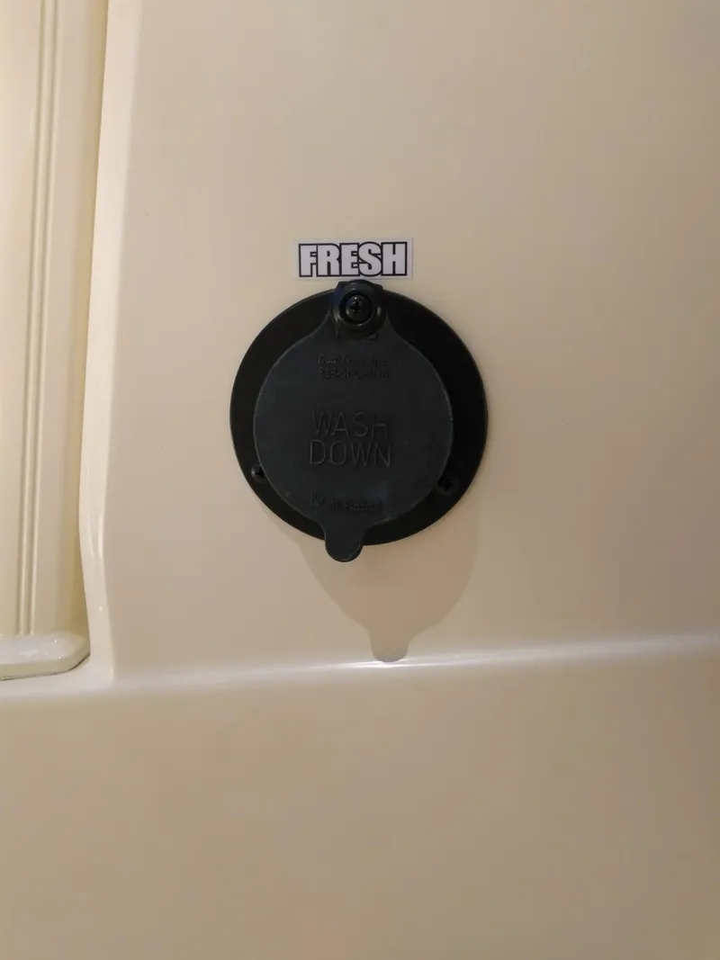 Slide: The Image of Freshwater washdown port on 2025 Scout 277 LXF boat. - 14