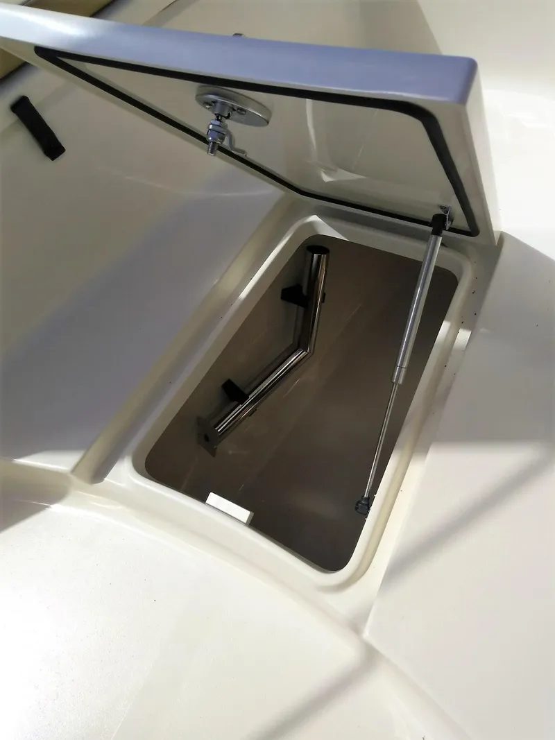 Slide: The Image of 2025 Scout 277 LXF boat storage compartment with hydraulic lift - 17