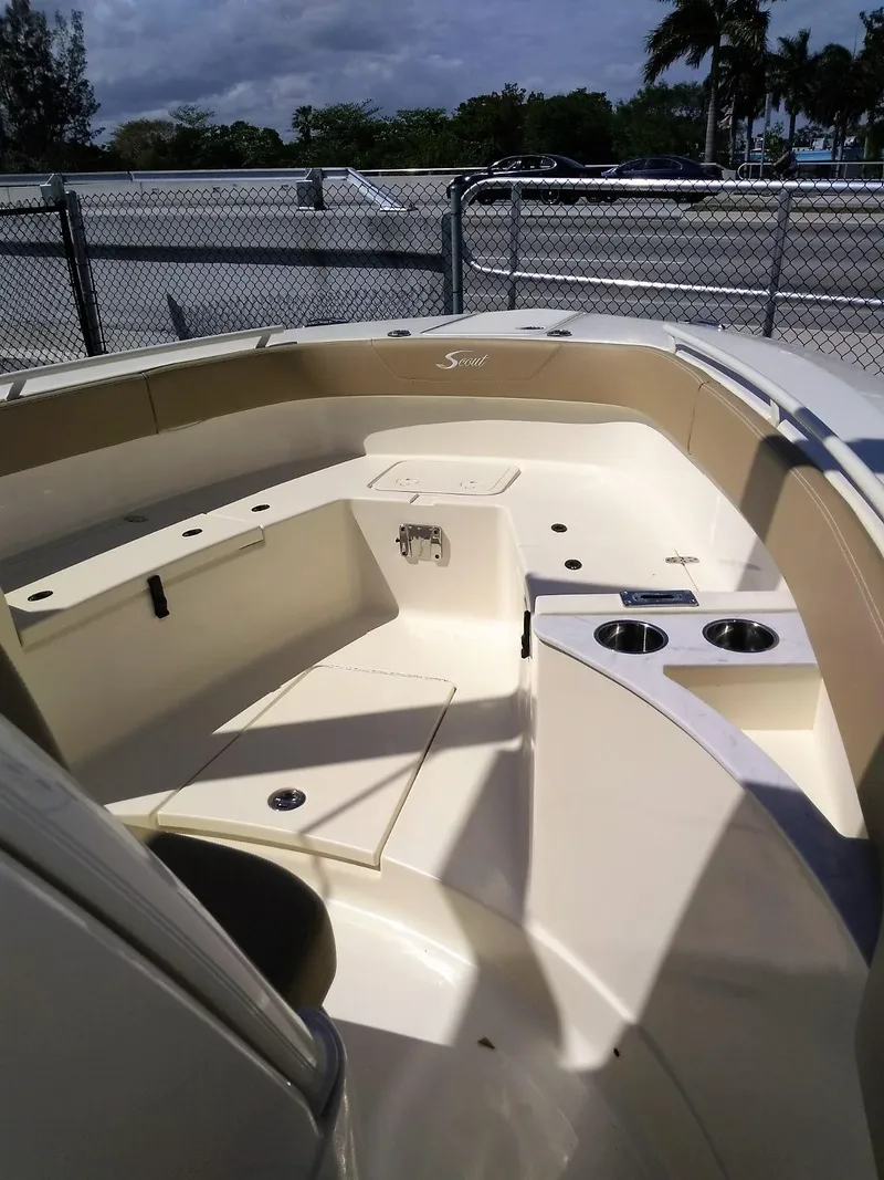 Slide: The Image of 2025 Scout 277 LXF boat interior with seating and cup holders. - 4