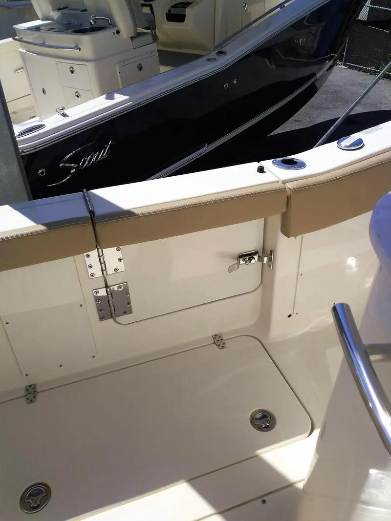 Slide: The Image of 2025 Scout 277 LXF boat interior, featuring seating and storage compartments. - 6
