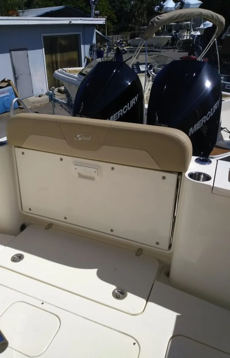 Slide: The Image of 2025 Scout 277 LXF boat with dual Mercury engines. - 7