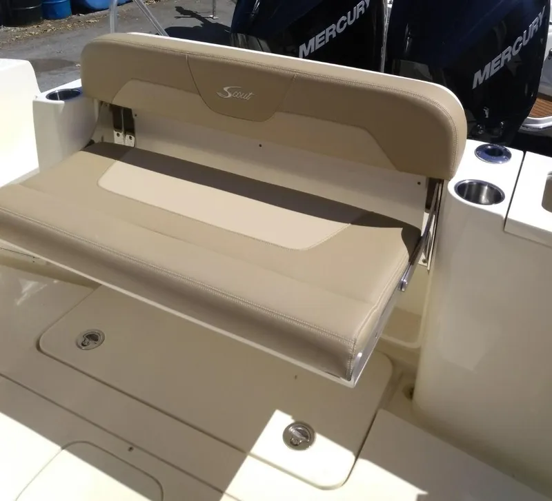 Slide: The Image of 2025 Scout 277 LXF boat with beige fold-down seat and Mercury engines. - 8