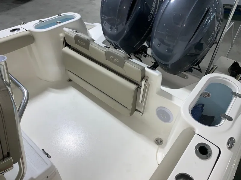 Slide: The Image of 2024 Key West 244 Center Console boat interior with twin outboard engines. - 11