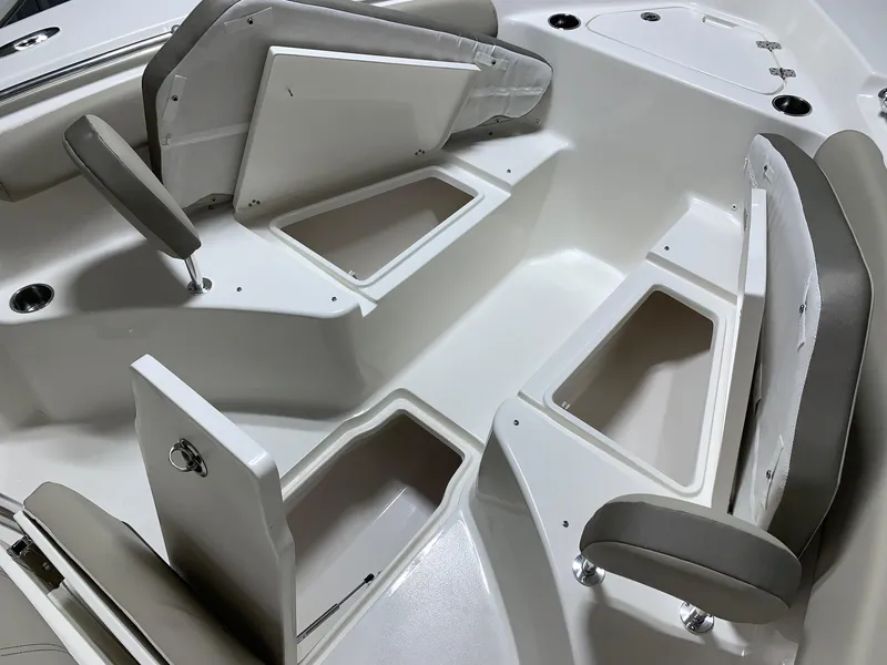 Slide: The Image of 2024 Key West 244 Center Console boat interior with open storage compartments. - 16