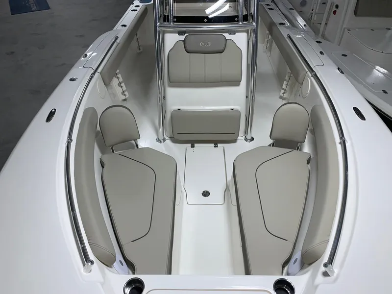 Slide: The Image of 2024 Key West 244 Center Console boat interior with beige seating. - 19