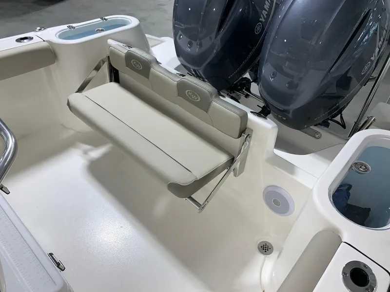 Slide: The Image of 2024 Key West 244 Center Console boat with dual Yamaha engines and foldable rear seat. - 10