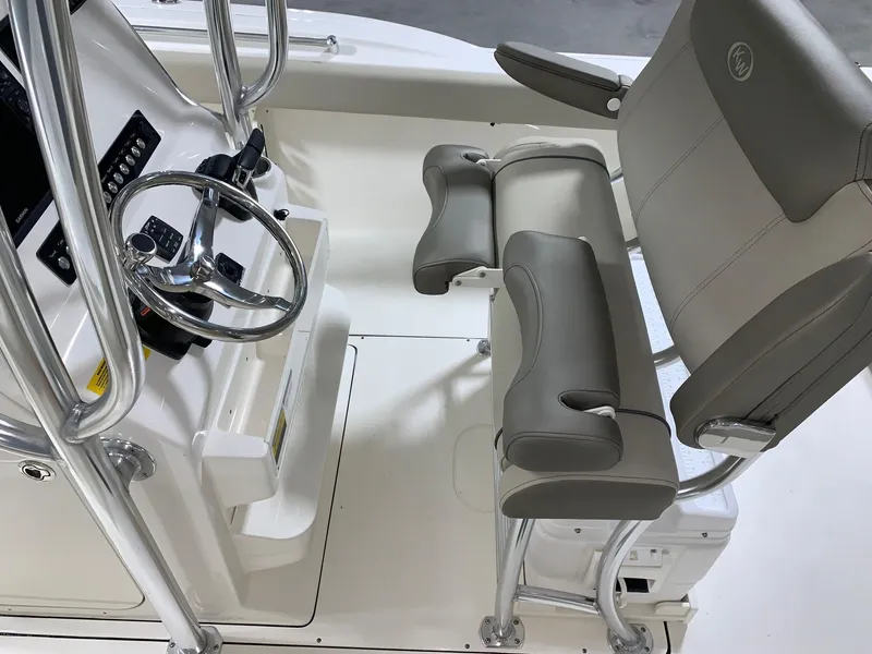 Slide: The Image of 2024 Key West 244 Center Console boat interior with steering wheel and seating. - 12