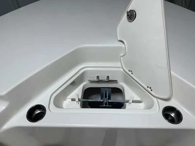 Slide: The Image of 2024 Key West 244 Center Console anchor storage compartment with open hatch. - 18