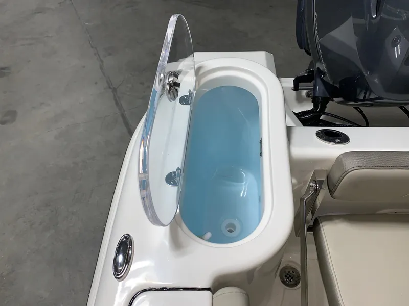 Slide: The Image of 2024 Key West 244 Center Console livewell with open lid. - 9