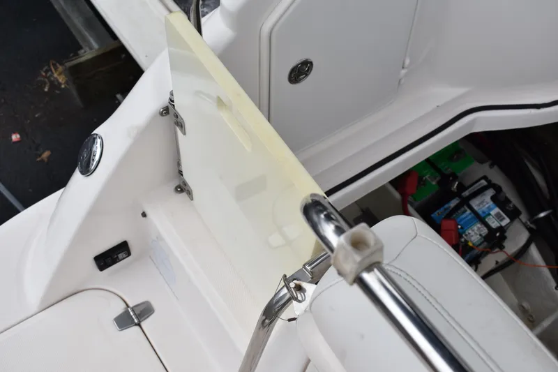 Slide: The Image of 2005 Regal Commodore 2665 boat interior with open hatch and visible battery compartment. - 14
