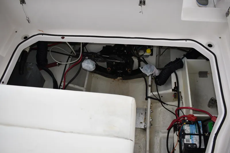 Slide: The Image of Engine compartment of a 2005 Regal Commodore 2665 boat, showing wiring and battery. - 20