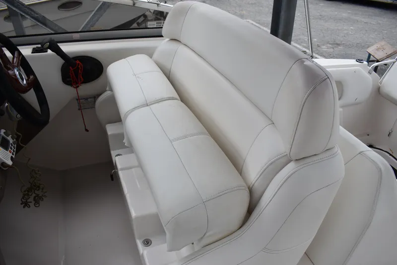 Slide: The Image of 2005 Regal Commodore 2665 boat interior with white leather seating. - 23