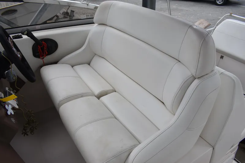 Slide: The Image of White leather seating in 2005 Regal Commodore 2665 boat interior. - 24