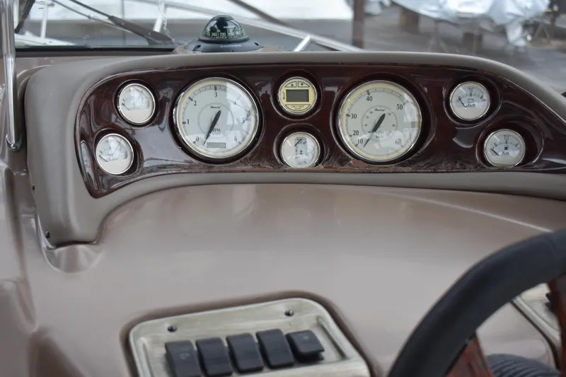 Slide: The Image of Dashboard of a 2005 Regal Commodore 2665 boat with gauges and controls. - 25