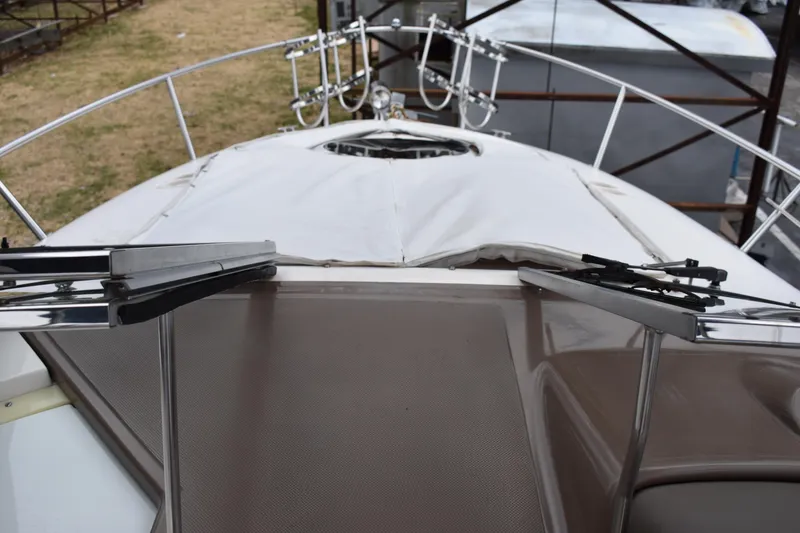 Slide: The Image of 2005 Regal Commodore 2665 boat deck with railing and covered hatch. - 27