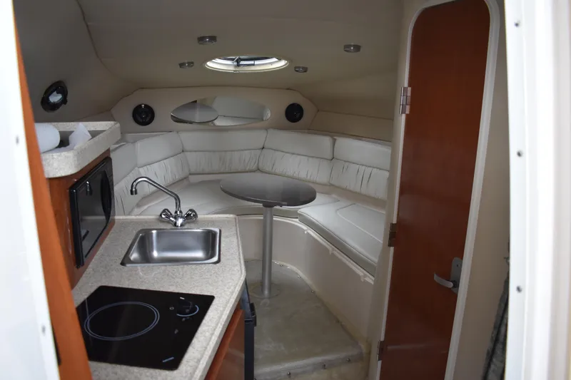 Slide: The Image of 2005 Regal Commodore 2665 cabin interior with kitchenette and seating area. - 29