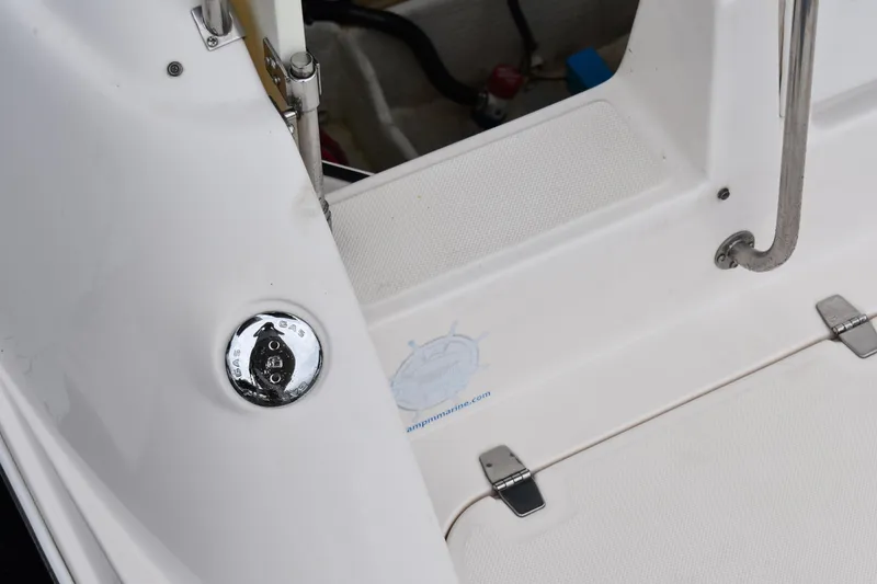 Slide: The Image of 2005 Regal Commodore 2665 boat deck with chrome fixtures and white surface. - 3